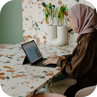 happy-muslim-woman-taking-photo-with-friends-using-7CJGV35 1